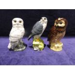 Three Royal Doulton Whyte and Mackay Scotch Whisky Birds of Prey: Snowy Owl, Tawny Owl and Merlin,