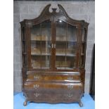 An imposing French walnut 19th century style Bombe Display Cabinet, broken arch pediment above a