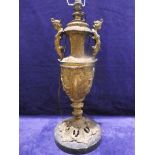 A 19th century gilt metal Lamp Base, classical urnular design, applied handles as Carryatids, relief