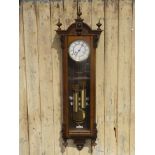 A 19th century mahogany cased Vienna style Wall clock, two weight eight day chiming movement,