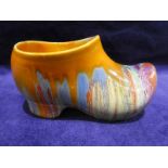 A Clarice Cliff Delecia pottery Clog, polychrome enamelled in dribbled glaze, 14cm long