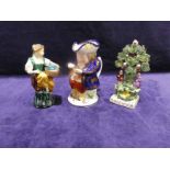 A Staffordshire Toby Jug - Snuff Taker and Majolica figurine of lady and basket and flatback (3)