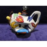 A Carlton Ware novelty Teapot as a Golly flying a Biplane