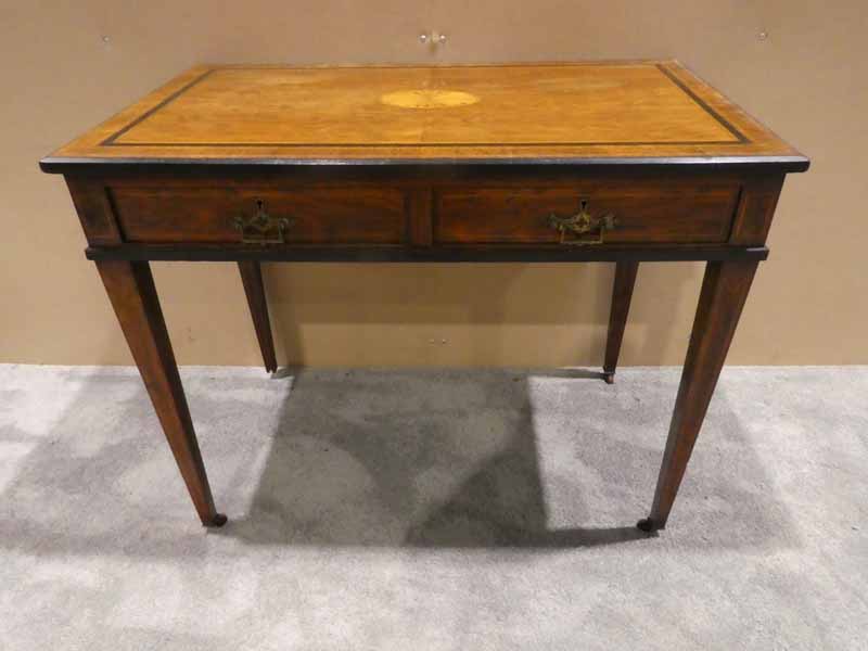 An Edwardian rosewood two-drawer Writing Table, chamfered edge rectangular top, crossbanded and line