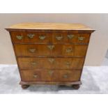 A Queen Anne walnut Chest of Drawers, five plank rectangular top with moulded edge shows dovetail