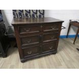 A mid 18th century oak Campaign Chest of Drawers, moulded edge rectangular top, above three