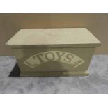 A painted pine Toy Chest with 'Toys' carved into the front and holes for rope handles