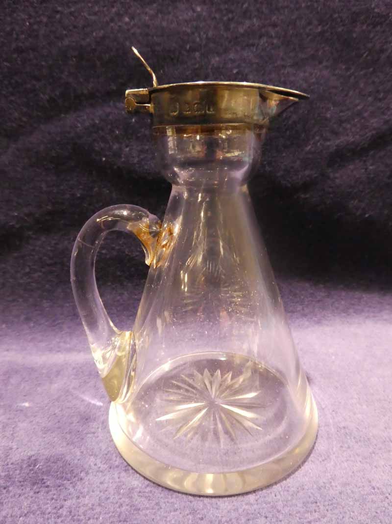 An early 20th century glass and silver top whisky Toddy, hinged silver lid, circular conical glass