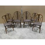 A set of six Bentwood Dining Chairs with heraldic carved backs and crinoline stretchers, two carvers