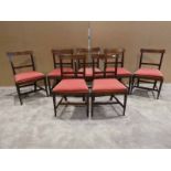 A set of seven William IV mahogany Dining Chairs, including a single carver, straight bar back