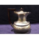 An early 20th century silver Teapot, rounded rectangular form with elongated neck, hinged,