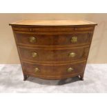 A George III mahogany and triple crossbanded bow front Chest of Drawers with beize lined brushing