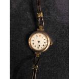 A Ladies 9ct gold Wrist Watch with white enamel face, G Marsden, Darwen, on leather strap, 30mm