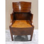 A Georgian mahogany Bedside Commode, bowed square form with fold up top shelf over a hinged lid