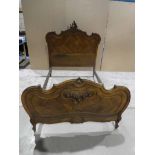 A French walnut Double Bed in Rococo style with moulded edges and applied floral carving, mattress