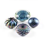 A GROUP OF FOUR BLUE IRIDESCENT ART GLASS PAPERWEIGHTS, MODERN, from largest to smallest, a clear