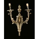 A LOUIS XVI STYLE GILT METAL DUAL LIGHT SCONCE, LATE 19TH CENTURY, the central flaming swirling