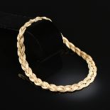 AN 18K YELLOW GOLD GUCCI NECKLACE, the double rope braided design with hidden push button box