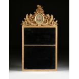 AN ITALIAN NEOCLASSICAL GILTWOOD TRUMEAU MIRROR, LATE 18TH/EARLY 19TH CENTURY, the crest centering a