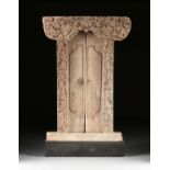A BALINESE PADMA CARVED TEAK DOORWAY PORTAL, EARLY/MID 19TH CENTURY, the upward curving crest with