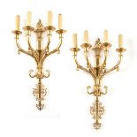 A PAIR OF FRENCH EMPIRE GILT BRONZE FOUR LIGHT WALL SCONCES, EARLY/MID 20TH CENTURY, the torch