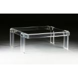 A CONTEMPORARY CLEAR GLASS AND ACRYLIC COFFEE TABLE, the rectangular glass top enclosed by a