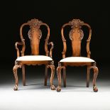 A SET OF EIGHT GEORGE II STYLE CARVED WALNUT DINING CHAIRS, 19TH CENTURY, comprising two armchairs