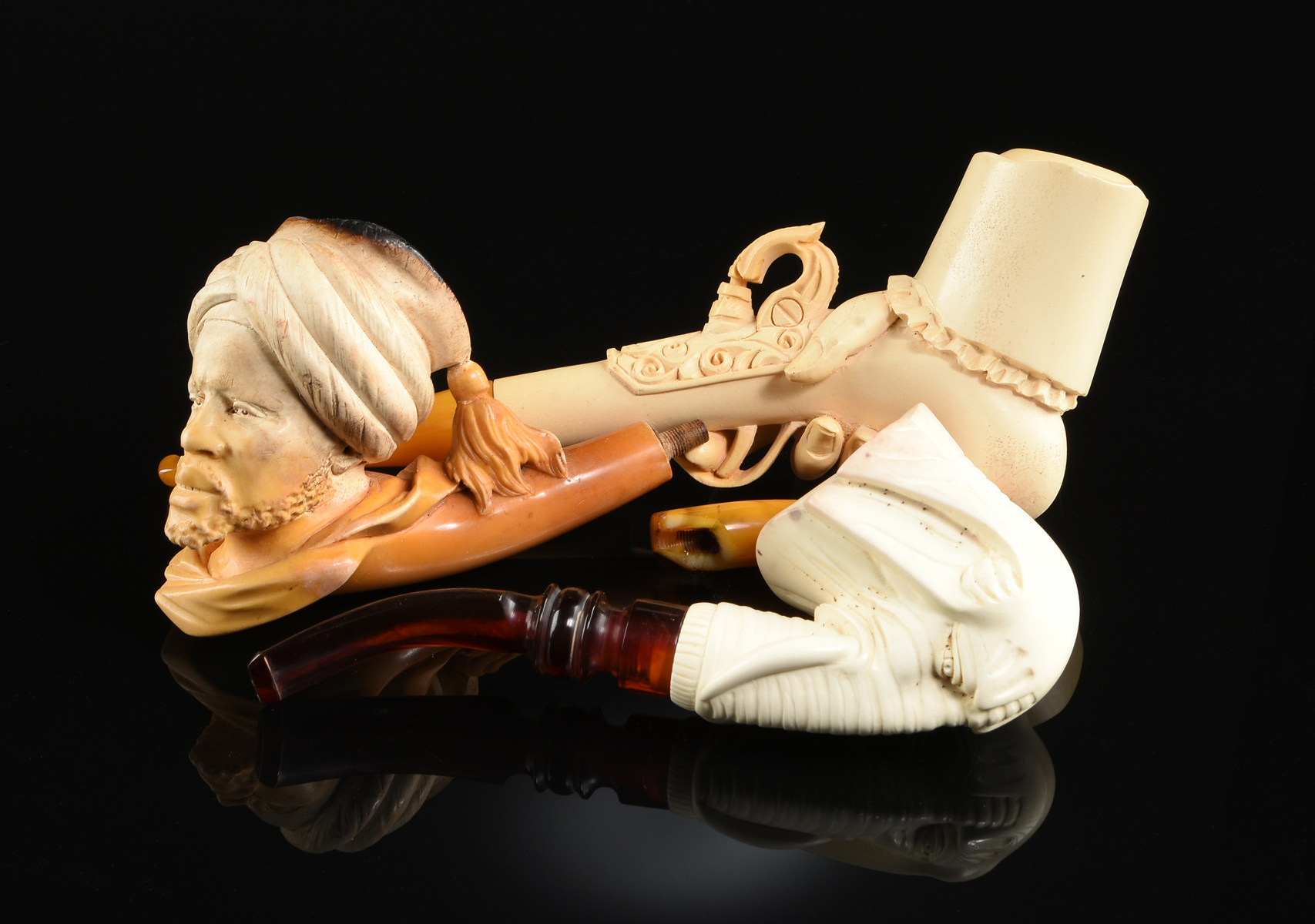 A GROUP OF THREE MEERSCHAUM TOBACCO PIPES, LATE 19TH/EARLY 20TH CENTURY, carved in the form of a