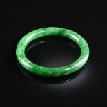 A NATURAL JADEITE BANGLE, PHU NHUAN JEWELRY, VIETNAM, LATE 20TH CENTURY, medium to dark green