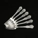 A RARE SET OF TWELVE TIFFANY & CO. STERLING SILVER DINNER FORKS, OLYMPIAN PATTERN, ZEUS WITH HIS