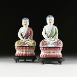 A PAIR OF FAMILLE ROSE PARCEL GILT ENAMELED BUDDHA FIGURINES, ATTRIBUTED TO THE LATE QING DYNASTY (