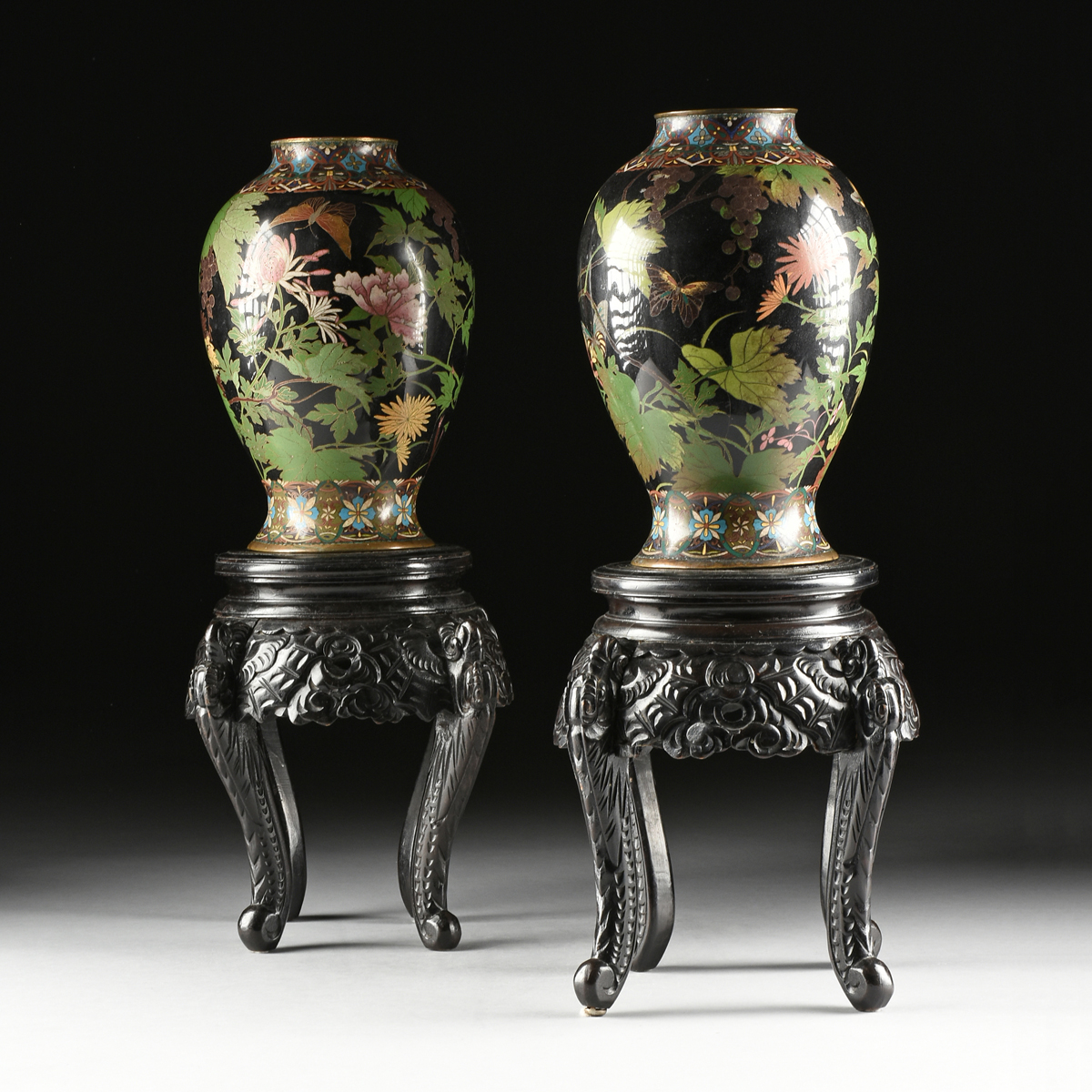 A PAIR OF ANTIQUE JAPANESE BLACK GROUND CLOISONNÃ‰ VASES WITH STANDS, TAISHO PERIOD (1912-1926),