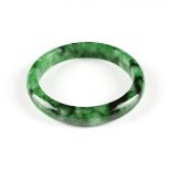 A NATURAL JADEITE BANGLE, PHU NHUAN JEWELRY, VIETNAM, LATE 20TH CENTURY, medium to dark green