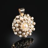 A YELLOW GOLD AND PEARL PENDANT, the circular floral design set with thirty-six champagne toned