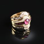 A YELLOW GOLD, RUBY, AND DIAMOND LADY'S RING, the 5mm x 6mm oval cabochon ruby flanked by eight