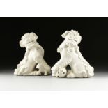 A PAIR OF CHINESE EXPORT BUDDHISTIC LIONS, EARLY 20TH CENTURY, each of heavy white glaze over