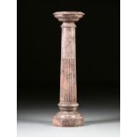 A CONTINENTAL TUSCAN ORDER STYLE VARIEGATED GRAY AND ROSE MARBLE PEDESTAL, 20TH CENTURY, the