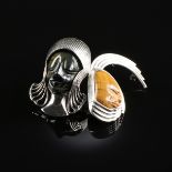 A PAIR OF MEXICAN STERLING SILVER AND TIGER'S EYE MASK BROOCHES, TALLERES DE LOS BALLESTEROS, TAXCO,