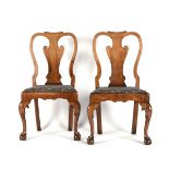 A PAIR OF GEORGE I CARVED YEW CHAIRS, CIRCA 1720, the head rest carved crest rails over vasiform