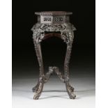 A CHINESE REPUBLIC PERIOD MARBLE TOPPED AND CARVED HARDWOOD PEDESTAL STAND, 1912-1949, the octagonal