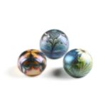 THREE ORIENT AND FLUME IRIDESCENT ART GLASS PAPERWEIGHTS, CALIFORNIA, 1975-1979, comprising a yellow