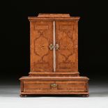 A SOUTH GERMAN PARQUETRY INLAID WALNUT SARCOPHAGUS FORM TABLE TOP CABINET, 18TH CENTURY, in the