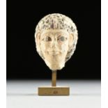 AN ANCIENT EGYPTIAN CARVED AND PAINTED LIMESTONE PORTRAIT HEAD OF A ROYAL PRINCESS, POSSIBLY OLD