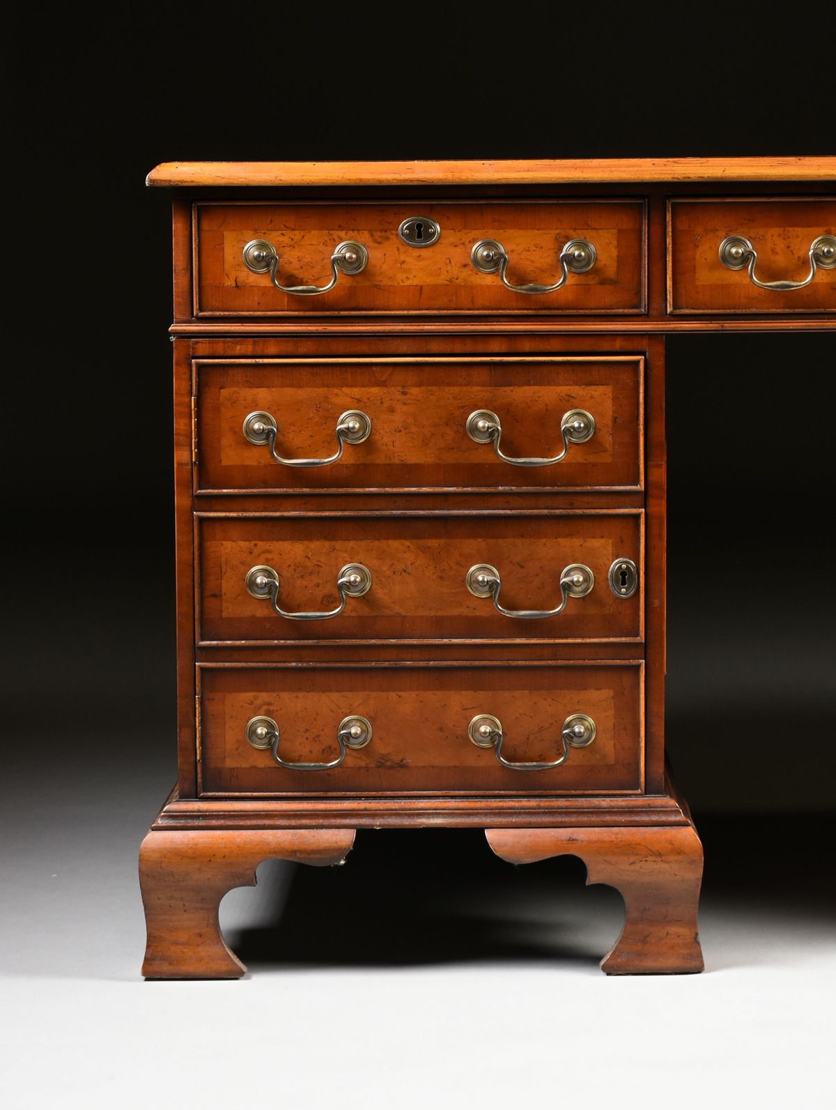 A GEORGE II STYLE WALNUT BURGUNDY LEATHER TOP PARTNER'S DESK, ENGLISH, MID 20TH CENTURY, modeled - Image 2 of 15