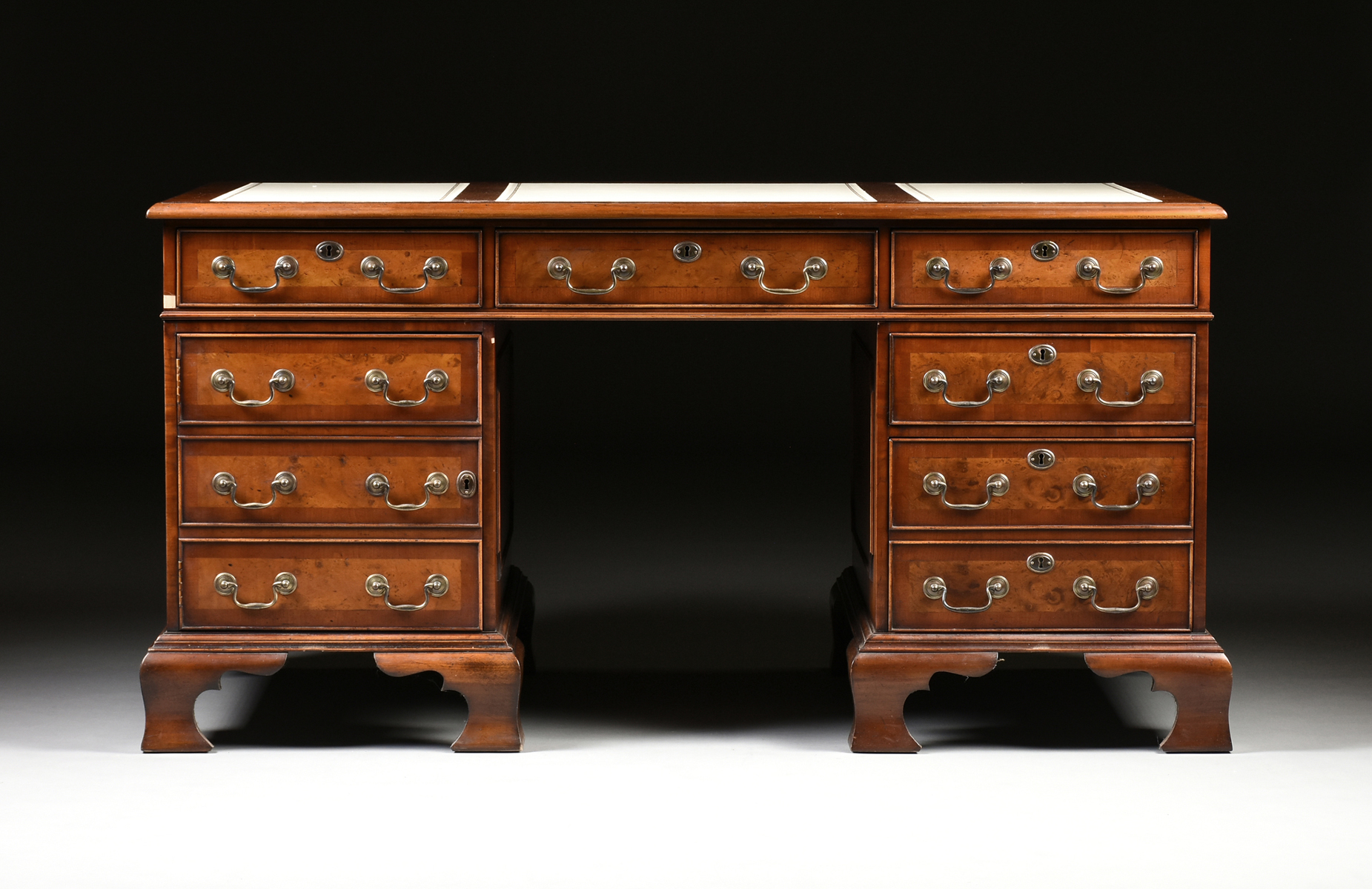 A GEORGE II STYLE WALNUT WHITE LEATHER TOP PARTNER'S DESK, ENGLISH, MID 20TH CENTURY, modeled