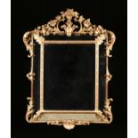 A BELLE Ã‰POQUE PARCEL GILT GESSO CUSHION MIRROR, CIRCA 1900, the pierced trefoil and feather