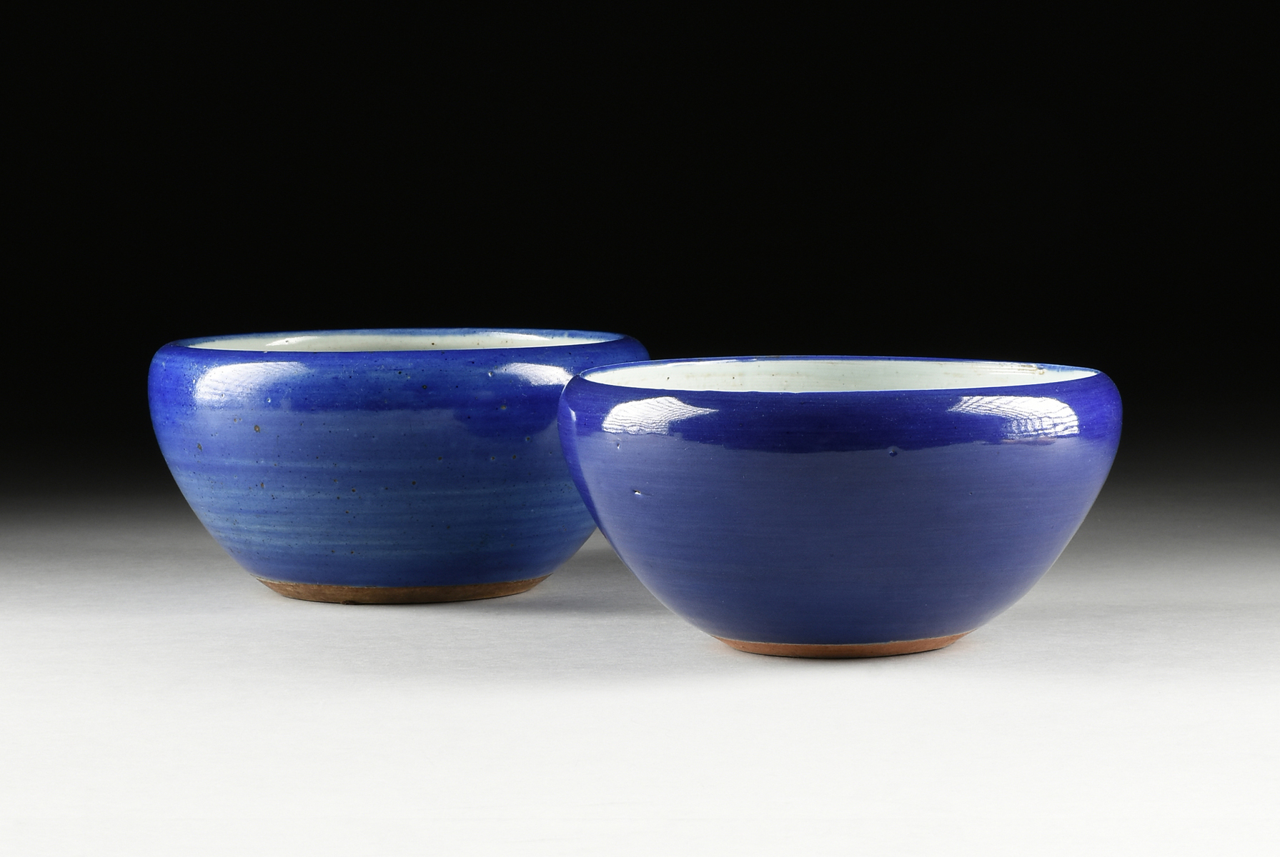 TWO CHINESE MONOCHROME BLUE GLAZED PLANTERS, LATE QING DYNASTY (1644-1912)/EARLY REPUBLIC PERIOD (