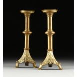 A PAIR OF NEO-GOTHIC BRONZE CANDLESTICKS, LATE 19TH/EARLY 20TH CENTURY, each with a circular shallow