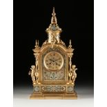 A NAPOLEON III CHAMPLEVE ENAMELED GILT BRONZE MANTLE CLOCK, MID 19TH CENTURY, the circular dial with