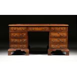 A GEORGE II STYLE WALNUT BURGUNDY LEATHER TOP PARTNER'S DESK, ENGLISH, MID 20TH CENTURY, modeled